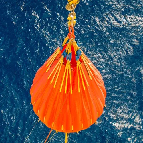 Comprehensive Load Testing Solutions- Bosss Marine Load test being dropped down into sea next to ship for load testing services